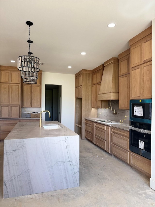 kitchen featuring custom exhaust hood, a sink, hanging light fixtures, unfinished concrete flooring, and backsplash