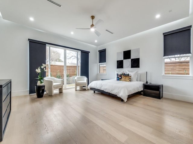 bedroom with light wood-style floors, visible vents, baseboards, and recessed lighting