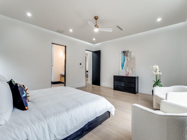 bedroom with light wood finished floors, baseboards, visible vents, and recessed lighting