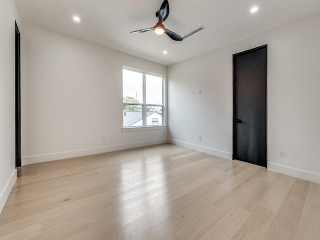 unfurnished room with baseboards, light wood finished floors, a ceiling fan, and recessed lighting