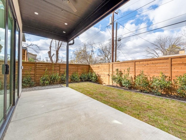 view of patio / terrace featuring a fenced backyard and a ceiling fan