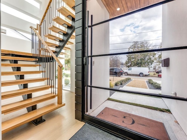 stairway featuring wood finished floors