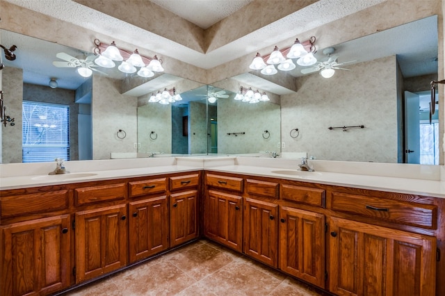 full bathroom featuring double vanity, a sink, and a ceiling fan