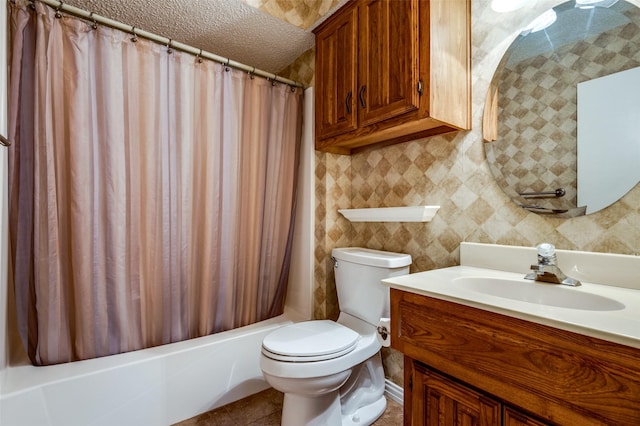 bathroom with toilet, shower / bath combo with shower curtain, a textured ceiling, vanity, and tile patterned flooring