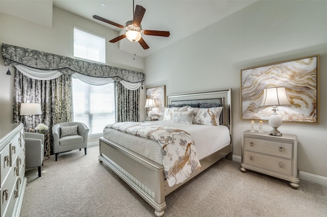 bedroom featuring carpet, multiple windows, and baseboards