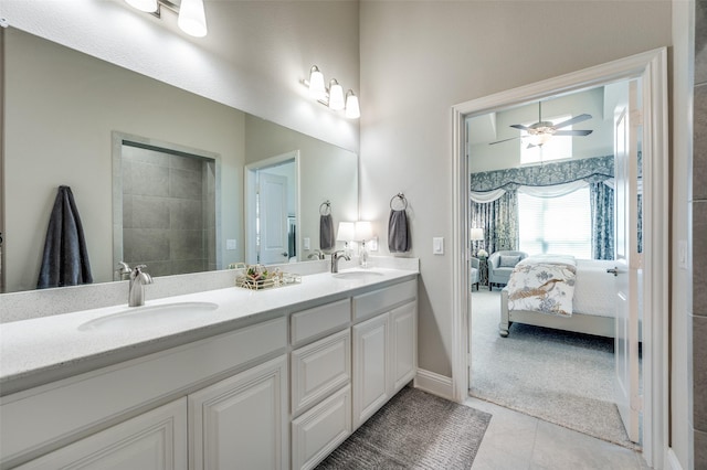 full bathroom featuring double vanity, ensuite bath, tile patterned flooring, and a sink