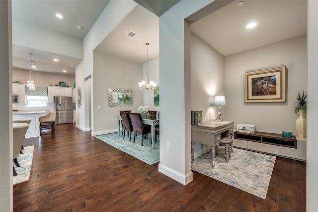 office with dark wood-type flooring, an inviting chandelier, visible vents, and baseboards