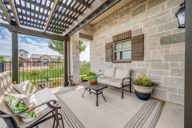 view of patio featuring an outdoor living space and a pergola