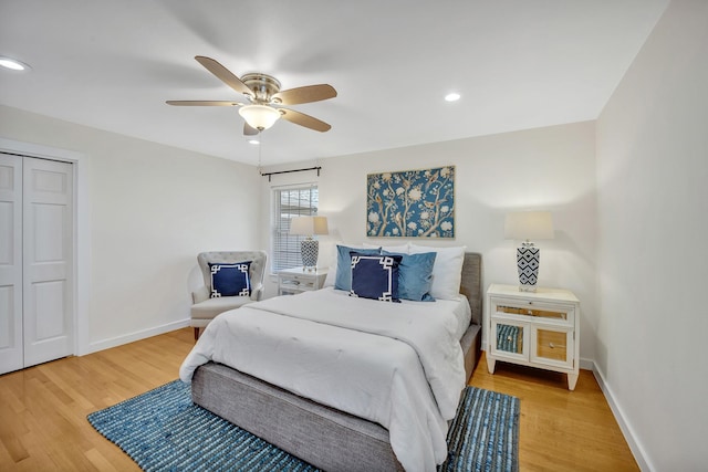 bedroom with a ceiling fan, baseboards, wood finished floors, and recessed lighting