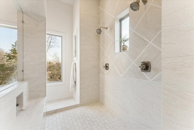 bathroom with a tile shower