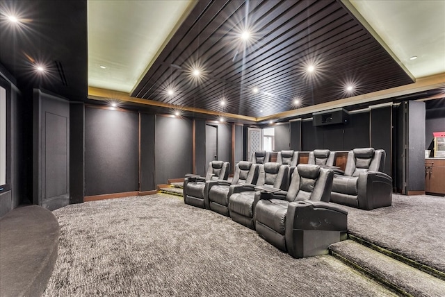 cinema room with carpet flooring and a decorative wall