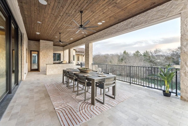 view of patio / terrace featuring a ceiling fan and outdoor dining space