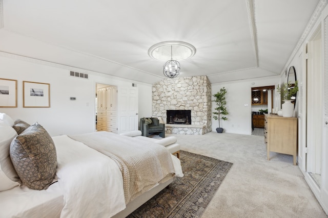 bedroom featuring light carpet, visible vents, ornamental molding, an inviting chandelier, and a fireplace