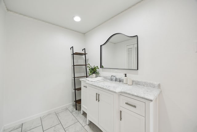 bathroom featuring marble finish floor, recessed lighting, baseboards, and vanity