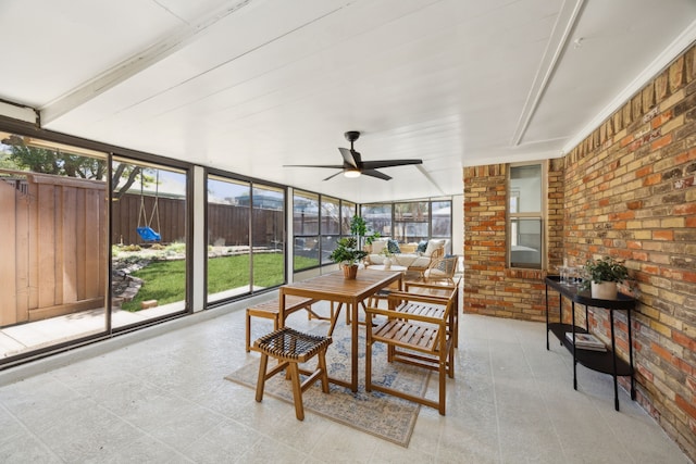 sunroom with a ceiling fan