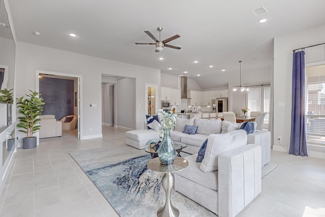 living room with a ceiling fan, recessed lighting, light tile patterned flooring, and visible vents