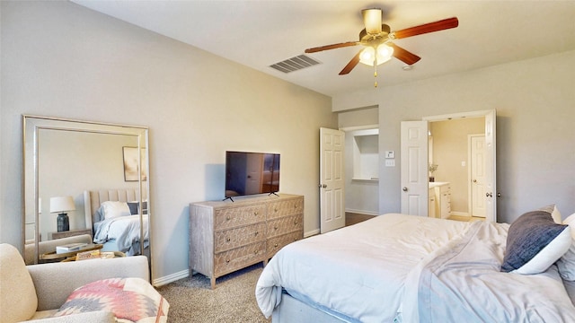 bedroom with carpet, visible vents, ensuite bathroom, ceiling fan, and baseboards