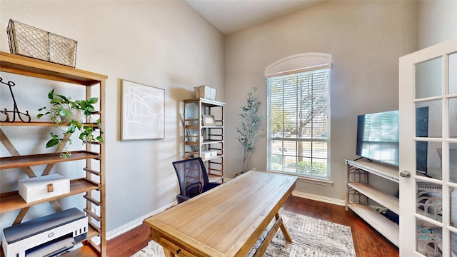 office space featuring wood finished floors and baseboards