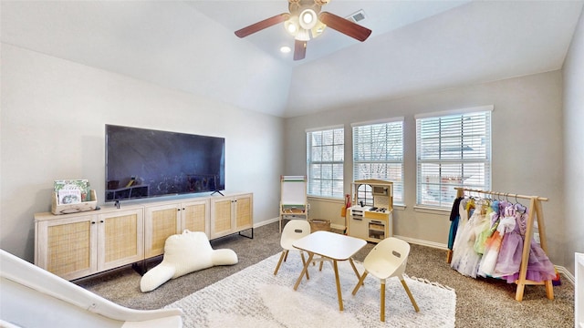 rec room with visible vents, carpet flooring, vaulted ceiling, ceiling fan, and baseboards