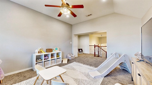 playroom with lofted ceiling, carpet, visible vents, and baseboards