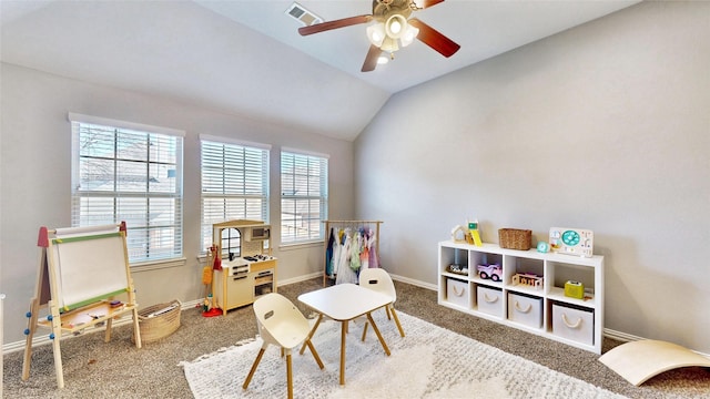 game room with carpet floors, lofted ceiling, visible vents, ceiling fan, and baseboards