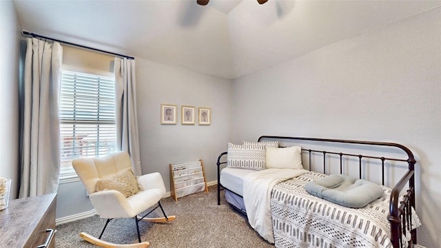 carpeted bedroom featuring vaulted ceiling, ceiling fan, and baseboards