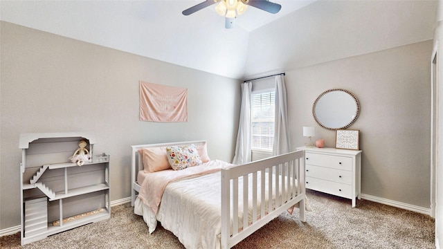 carpeted bedroom featuring lofted ceiling, baseboards, and a ceiling fan