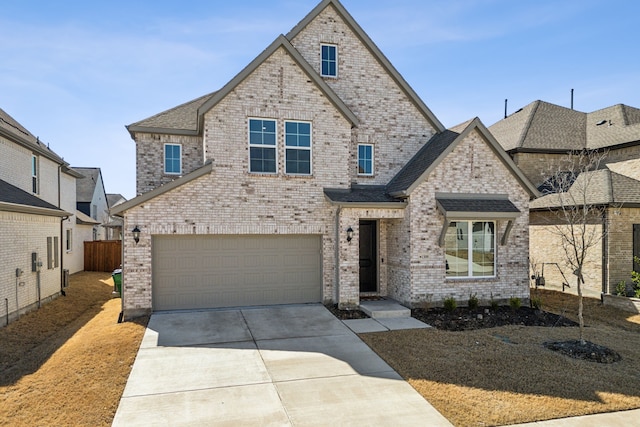 view of front of house featuring driveway, a garage, and brick siding