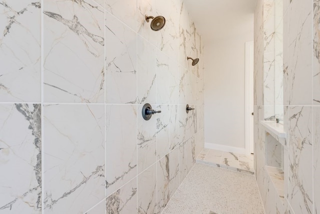 full bathroom with tiled shower