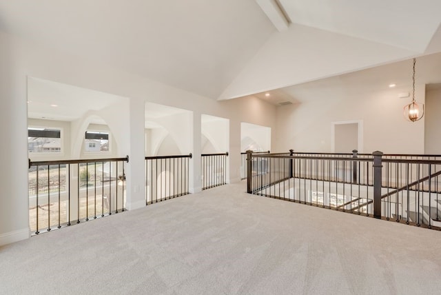 carpeted empty room featuring high vaulted ceiling, beamed ceiling, and recessed lighting