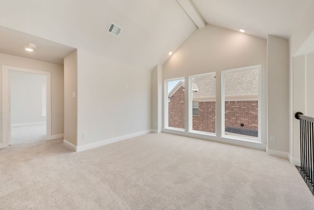 interior space with high vaulted ceiling, visible vents, beamed ceiling, and baseboards