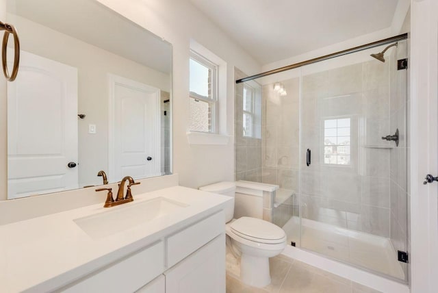 full bathroom with toilet, a shower stall, tile patterned flooring, and vanity