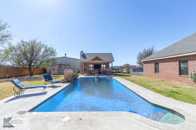 357 County Road 337, Tuscola, TX 79562 - view of pool featuring a fireplace, a yard, a patio, and a fenced backyard