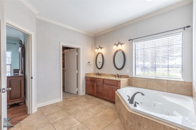 357 County Road 337, Tuscola, TX 79562 - bathroom with a jetted tub, double vanity, ornamental molding, tile patterned flooring, and a sink