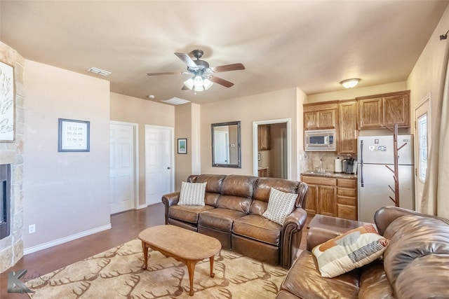 357 County Road 337, Tuscola, TX 79562 - living room with concrete flooring, baseboards, a ceiling fan, and visible vents