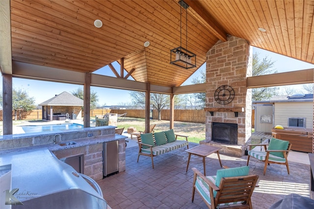 357 County Road 337, Tuscola, TX 79562 - view of patio featuring a gazebo, a fenced backyard, a sink, and exterior kitchen