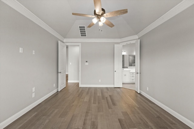 unfurnished bedroom with visible vents, crown molding, baseboards, and wood finished floors