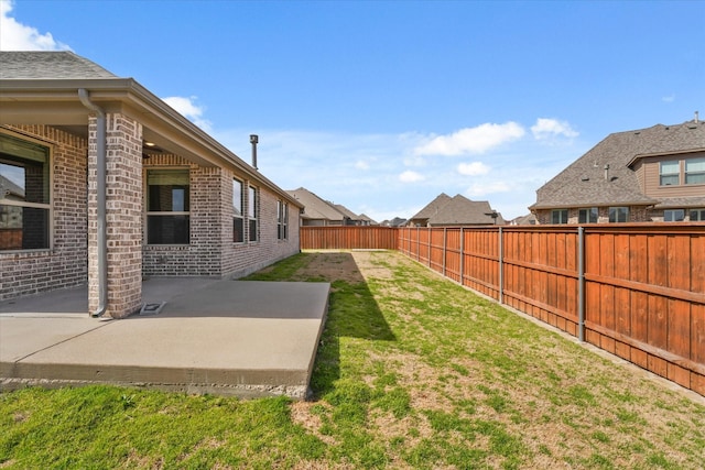 view of yard with a patio area and a fenced backyard