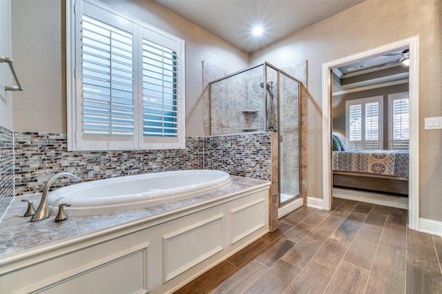 full bath with wood tiled floor, connected bathroom, a garden tub, and a shower stall