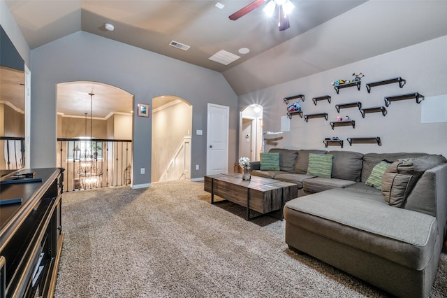 living area featuring visible vents, ceiling fan with notable chandelier, carpet floors, arched walkways, and vaulted ceiling