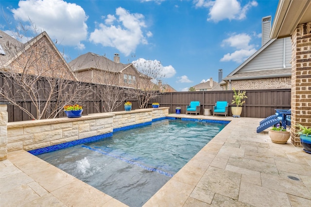 view of swimming pool with a fenced in pool, a patio, and a fenced backyard