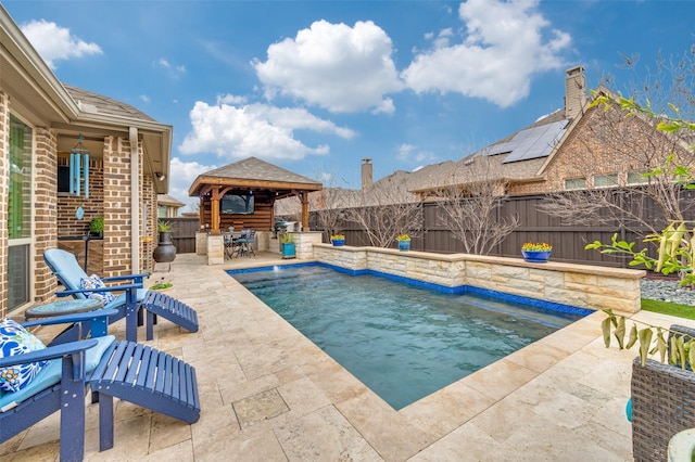 view of pool featuring a gazebo, a patio area, a fenced backyard, and a fenced in pool