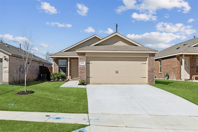 view of front of house featuring an attached garage, brick siding, a shingled roof, driveway, and a front yard