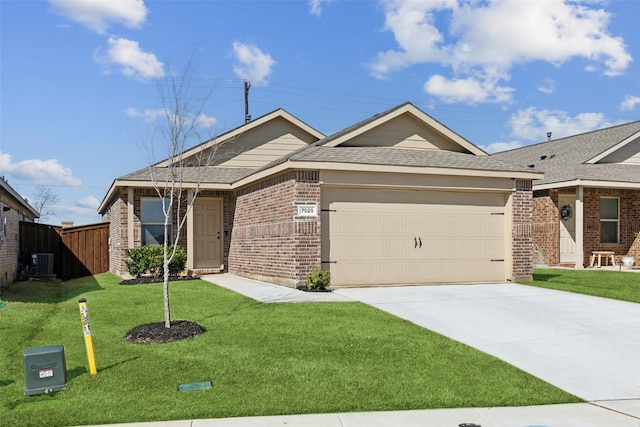 ranch-style home with driveway, brick siding, an attached garage, cooling unit, and a front yard