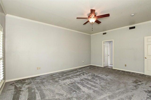 carpeted empty room featuring baseboards, visible vents, and ornamental molding