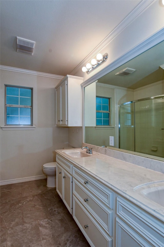 bathroom featuring ornamental molding, a sink, and a shower stall