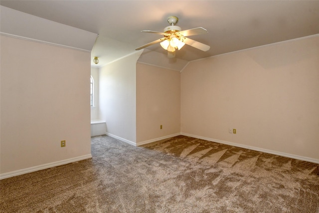 additional living space featuring vaulted ceiling, carpet, a ceiling fan, and baseboards