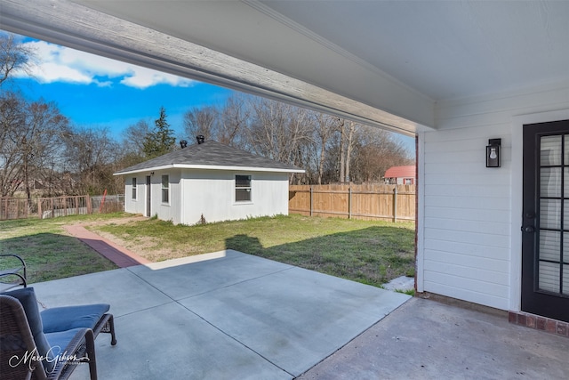 view of patio / terrace featuring an outbuilding and a fenced backyard