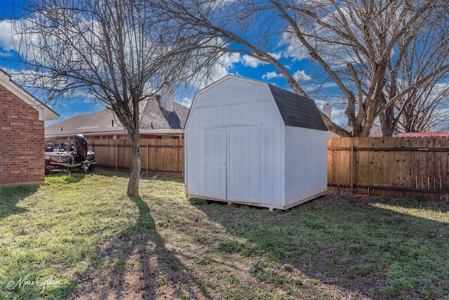 view of shed with a fenced backyard