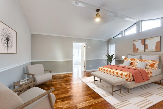 bedroom featuring crown molding, lofted ceiling with beams, ceiling fan, wood finished floors, and baseboards